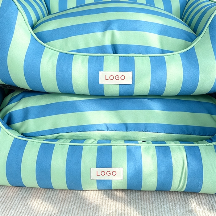 Polyester canvas dog beds in light green and sky blue stripes stacked, showing small and large size difference