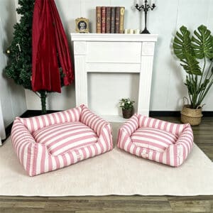Pink and white striped pattern pet bed full view comparing small and large sizes
