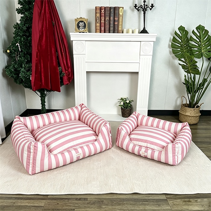 Pink and white striped pattern pet bed full view comparing small and large sizes